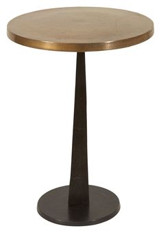 a round wooden table with an iron base and gold leaf decoration on the top, against a white background