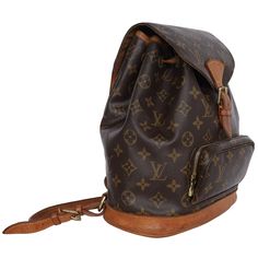 Authentic Louis Vuitton Brown Monogram Montsouris Backpack Mm (Medium size). Features monogram canvas with leather trim, front zippered pouch, top string closure with buckle front flap, the interior has a brown textile lining with slip pocket, adjustable shoulder straps. This bag is perfect for shopping, travel, school, and hands-free needs. Unisex bag! Authenticity Date Code: SP0024 Made in France Strap Drop: (adjustable) Classic Travel Backpack In Monogram Canvas, Classic Monogram Canvas Travel Backpack, Monogram Canvas Backpack For Daily Use, Classic Brown Monogram Canvas Backpack, Brown Monogram Canvas Backpack, Daily Use Monogram Canvas Backpack, Classic Monogram Canvas Backpack For Everyday Use, Travel Backpack With Monogram Canvas, Travel Backpack In Monogram Canvas