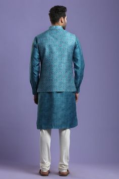 Ocean blue bundi with bandhani print and overlap detail. Paired with churidar and kurta.
Component: 3
Pattern: Printed
Type Of Work: Bandhani
Neckline: Band
Sleeve Type: Full Sleeves
Fabric: Silk Blend
Color: Blue
Other Details: 
Overlap bundi
Bandhani print
Occasion: Destination Wedding - Aza Fashions Blue Nehru Jacket For Diwali With Traditional Drape, Blue Traditional Drape Nehru Jacket For Diwali, Bollywood Style Sherwani With Bandhani Print For Navratri, Blue Nehru Jacket With Pallu For Eid, Blue Bollywood Nehru Jacket For Festivals, Designer Blue Nehru Jacket With Pallu, Traditional Blue Nehru Jacket With Pallu, Blue Bollywood Nehru Jacket For Transitional Seasons, Blue Nehru Jacket With Zari Work