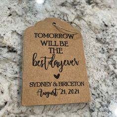 a tag with the words tomorrow will be the best day ever on it sitting on a marble countertop