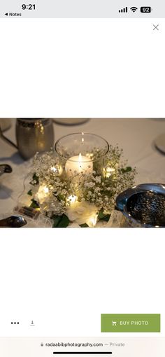 the table is set with candles and flowers