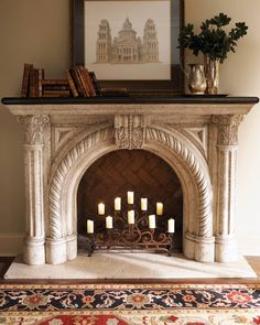 a fireplace with candles lit in front of it