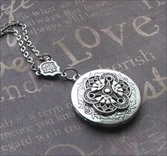 Silver Locket Necklace, Celtic Jewelry, Photo Picture Locket, Locket For Her, Celtic Wedding, Trinity Necklace, Mother of Three, Locket Gift This enchanted necklace features a beautiful locket adorned with an ornate silver filigree cabochon and rosary style connector. The chain measures 18 inches long and is secured with a lobster clasp. The locket is 1 and 1/4 inches tall and has space for two photos or anything else you choose to put inside. All plated in silver with an oxidized finish. Very h Metal Locket Necklace For Wedding, Adjustable Vintage Charm Wedding Jewelry, Adjustable Vintage Charm Jewelry For Wedding, Wedding Locket Pendant Jewelry, Antique Silver Round Bracelet For Wedding, Wedding Pendant Locket Jewelry, Vintage Adjustable Jewelry For Wedding, Antique Silver Round Bracelets For Wedding, Handmade Silver Jewelry For Marriage