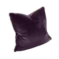 two purple pillows sitting on top of each other