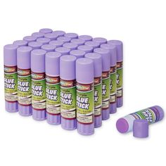 purple glue sticks are lined up in a row on a white background with the words blue tick