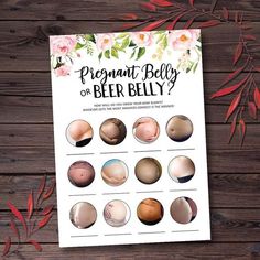 the pregnant belly chart is displayed on a wooden surface with flowers and leaves around it