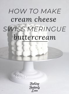 a white cake with the words how to make cream cheese swiss meringue buttercream