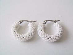 "This 7/8\" of an inch beaded white hoop earrings are woven with tiny white glass seed beads.  They are a little bigger than my other small white hoops. The earrings are woven on tarnish resistant stainless steel hoop frame with latch back closures. Hoops measure: 7/8\" of an inch across the widest part of the earrings ( 2.2225 cm ) outside diameter, ( that is almost an inch across ). https://www.etsy.com/shop/FMGuyDesigns" Hoop Frame, White Hoop Earrings, Summer Earring, Glass Seed Beads, Seed Bead Earrings, Bead Earrings, Jewelry Earrings Hoops, Glass Jewelry, Seed Bead