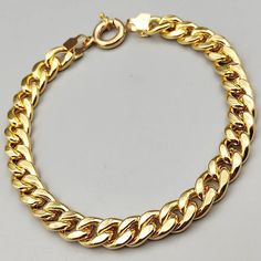 14k Real Gold Cuban Curb Link Chain Bracelet, 6 MM Width, Real Gold Gourmet Bracelet, Gift for Her, Gift for Him, Unisex Bracelet, Best Price Material: 14k Solid Gold (Not Gold Filled or Gold Plated) Karat: 14K (real gold) 585 Gold Color: Yellow Gold Closure: Lobster clasp Chain width: 6.5 mm , 7.5mm Thickness : 2,64 mm Perfect piece for every day look that can be used alone.Bracelet Includes a lobster clasp to uphold strength and comfort. This bracelet is made with real 14k gold and is stamped Link Chain Bracelet, Unisex Bracelets, Cuban Chain, Chain Link Bracelet, Metal Stamping, Bracelet Gift, Real Gold, Chain Styles, Link Chain