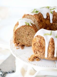 a bundt cake with white icing on a plate