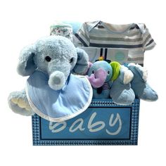 a baby's gift box with stuffed animals and bibs in it, including an elephant