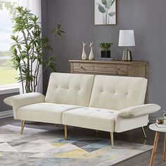 a living room with grey walls and white furniture