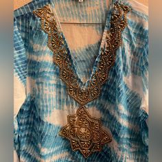 Gorgeous Coverup/ Tops /Dress Wear It Whichever Way You Like With Golden Beads Design In Front And Along Neck Line. Can Be Worn Both As Coverups Or Tops Or As Mini Dress!Take It To Your Vacations And Look Fashionable! New Without Tags A Gorgeous Coverup / Dress/ Tops So Many Ways To Wear. Blue Sequined Beach Dress, Blue Sequin Beach Dress, Embellished V-neck Kaftan For The Beach, Elegant Blue Festival Kaftan, Sequin Beach Dress For Beach Season, Beach Dresses With Sequins For Beach Season, Beach Season Sequined Dresses, Bohemian Sequin Beach Dresses, Sequin Beach Dress