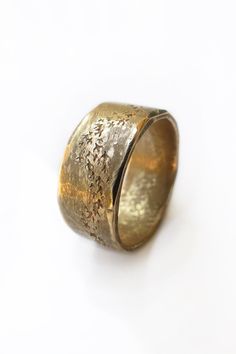 This handmade rustic masculine ring is hand carved in solid 14k yellow gold and features a murmuration design.  The nature inspired masculine ring has irregular filed edges finished with a high polish - creating a visually appealing contrast to the matte rough filed middle area of the band.  The starling birds on this large solid gold ring are carved to resemble the fluid like movement of a murmuration.  This rustic gold ring makes the perfect unique wedding band for a nature lover.  Murmuration Rustic Gold Wedding, Starling Birds, Thick Gold Ring, Rustic Wedding Bands, Bird Ring, Simple Wedding Bands, Bird Rings, Stacked Wedding Rings, Wedding Band Designs