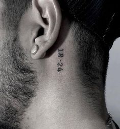 a man's neck with the word tattoo on it