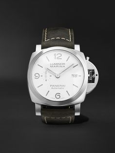 The 'Luminor Marina' watch is modelled after diving styles Panerai engineered for the Royal Italian Navy back in the 1940s. Featuring original design details, including a cushion-shaped stainless steel case, small seconds dial and crown-protecting bridge, this Swiss-made version is powered by an automatic P.9010 calibre that was developed at the label's manufacture in Neuchâtel. It has a signature sandwich dial, the cutouts on the top layer allow the luminescence to shine through, and is fitted Panerai Luminor Marina, Luminor Marina, Time Keeper, Panerai Luminor, Special Ops, Duke University, Green Suede, Men's Watches, Luxury Watches For Men