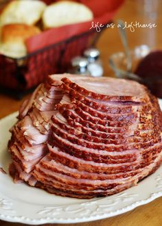 sliced ham sitting on top of a white plate