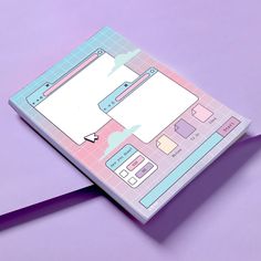 an open notebook on a purple surface with paper cut out to look like a computer screen