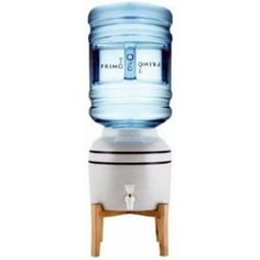 a water dispenser that is on top of a wooden stand with a white base