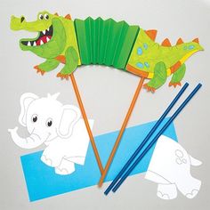 an elephant, alligator and giraffe paper craft with chopsticks