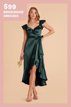 a woman is wearing a green dress with a bow at the waist and side slit