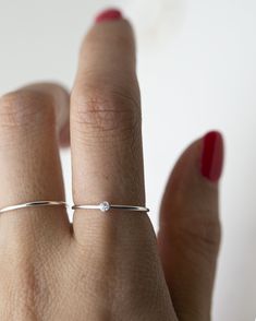 Small CZ Diamond Stacking Rings - It's a simple and classic everyday ring that adds a tiny sparkle to your finger :) Perfect as a stacking ring or by itself. This elegant Tiny CZ stone ring is made with 14K gold filled / sterling silver. ■ Pearl ring can be found here: https://www.etsy.com/listing/588155462/freshwater-pearl-ring-dainty-stacking?ref=shop_home_active_25 ■ SHIPPING UPGRADES You can find shipping upgrades options in the drop bar menu when you check out. * Within the U.S Regular Firs Minimalist Stackable Crystal Toe Ring, Dainty Everyday Ring With Tiny Details, Adjustable Solitaire Rings For Everyday, Dainty Round Band Rings For Everyday, Dainty Stackable Rings With Simple Design As Gift, Minimalist Adjustable Crystal Ring With Round Band, Silver Minimalist Diamond Ring, Everyday Tiny Midi Rings With Round Band, Minimalist Adjustable Solitaire Ring