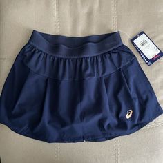 In Excellent Condition Navy Blue Color A60 Blue Mini Skort For Sports, Blue Mini Tennis Skirt With Elastic Waistband, Blue Casual Sports Skirt, Casual Blue Sports Skirt, Sporty Short Blue Skirt, Navy Skirted Skort, Navy Lined Skirted Skort, Navy Skirted Skort With Lined Skirt, Navy Lined Tennis Skirt