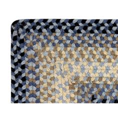 an area rug with blue, beige and black squares on the bottom is shown in full view