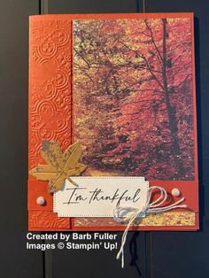 a close up of a card on a door with autumn leaves and the words, i'm grateful