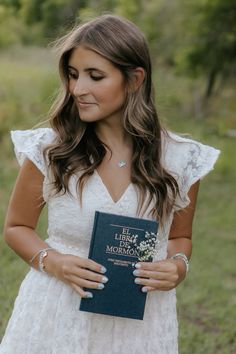 a woman holding a book in her hands