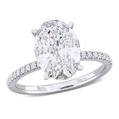 an oval cut diamond ring with pave set shoulders