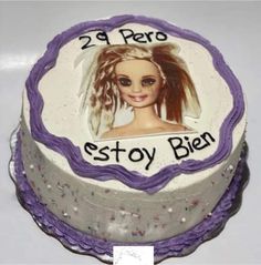 a birthday cake with a photo of a barbie doll on it