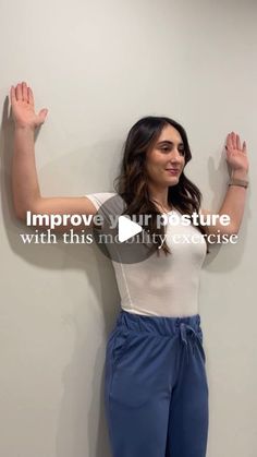 a woman standing in front of a wall with her hands up and the words improve your posture