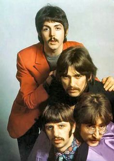 the beatles posing for a photo together