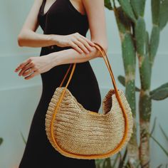 A sturdy double leather straps wrap the edge trim on the front and back of this roomy tote bag handwoven from raffia in a slightly slouchy silhouette to carry all your essentials. Perfect for the beach day and your summer road trips. Wipe clean with a damp cloth. Material: Raffia body and Leather handles. Chic Woven Leather Shoulder Bag, Chic Jute Straw Bag With Round Handle, Chic Jute Crochet Bag With Leather Handles, Chic Crochet Jute Bag With Leather Handles, Chic Crochet Bag With Leather Handles, Chic Jute Shoulder Bag, Chic Everyday Handwoven Hobo Bag, Jute Tote Hobo Bag, Chic Straw Bag With Natural Fiber