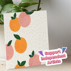 a card with oranges on it and the words support independent artists written in pink