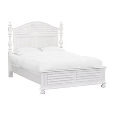 a white bed with two posts on the headboard and foot board, in front of a white background