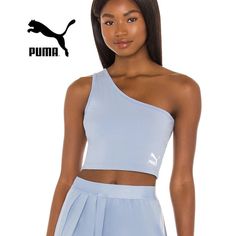 New W Tags Size Women Large Liven Up Your Look With The Puma Classics Asymmetric Bandeau. The Forever Faster Brand Sports A Forever Blue Colorway For This Piece While A Contrast Puma Cat Logo Makes An Appearance At The Front. Take Your Athletic Apparel To The Next Level And Enjoy This Remixed Classic. No Built In Bra! Slim Fit. Asymmetrical Hem Creates A Trendy Appeal. Materials: 93% Cotton, 7% Elastane. Pit To Pit 17" Length 16.5" Trendy Blue Activewear For Spring, One Shoulder Athleisure Activewear For Sports, Blue Sports Crop Top For Spring, Blue Athleisure Sports Bra For Spring, Trendy Blue Sports Crop Top, Blue Crop Top For Sports In Spring, Blue Athleisure, Pink Pumas, Puma Shirts