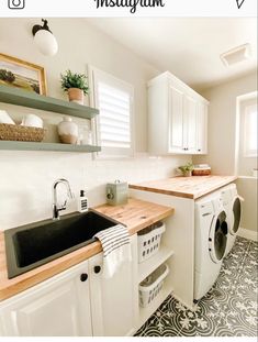 a washer and dryer in a small room with shelves above the washer