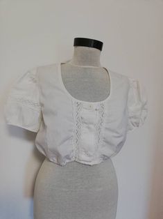 Beautiful crop top very good condition, like new fits a modern M. Vintage Crop Dirndl Top, White Trachten , Oktoberfest Clothing, you can style  it in am eclectic outfit as it is or with a Bavarian dress.  Shoulders 40cm Minimum underbust waist 68CM Maximum 106 cm elasticated waist.  Need more measurements? Just contact me and I will be happy to help. Fitted Cropped Shirt For Summer Daywear, Fitted Cotton Cropped Shirt For Daywear, White Fitted Cropped Shirt For Daywear, Cropped Cotton Shirt For Daywear, Fitted Crop Top For Daywear, Fitted Cropped Shirt For Daywear, Cotton Crop Top With Short Sleeves For Daywear, Eclectic Outfit, Austrian Fashion