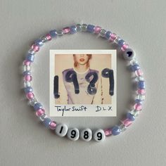 a bracelet that has been made with beads and an image of taylor swift on it