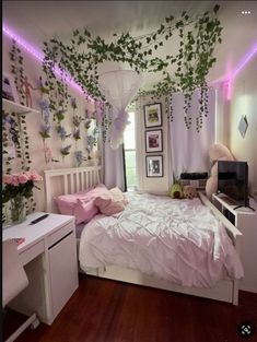 a bed room with a neatly made bed and lots of greenery on the walls