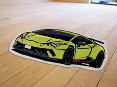 a yellow sports car shaped rug on the floor