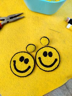 Perfect statement earrings for this festive season. Smiley happy face earrings will bring smiles to everyone that's around you! Beaded earrings for the festive season are available now at our shop. They are totally handmade and eye-catchy and are ready to rock your New Year's eve parties or any other party. These seed beads earrings have felt back and are very light-weighted. Please message me for bulk orders For more collection check out our full range of handmade products at https://www.etsy.c Trendy Handmade Earrings For Birthday, Trendy Handmade Earrings For Birthdays, Trendy Handmade Yellow Beaded Earrings, Fun Handmade Adjustable Earrings, Handmade Adjustable Fun Earrings, Fun Beaded Earrings For Summer Gifts, Yellow Round Beaded Earrings For Gifts, Cheerful Handmade Jewelry Gift, Fun Yellow Jewelry For Birthday