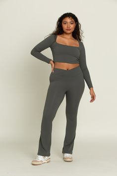 Feel effortlessly on trend for your workout class or a day on-the-go with our Dull Pine Flare Yoga Pants. The crossover waistband provides an elevated look, offering you both security and comfort for any activity. The flare leg creates an unrestricted yet chic design. Pair with our Dull Pine Square Neck Long Sleeve Top for the perfect set. Square Neck Long Sleeve Top, Flare Yoga Pants, Square Neck Long Sleeve, Sweaty Workouts, Yoga Outfit, Tennis Skirts, Athleisure Fashion, Athletic Top, Yoga Tops