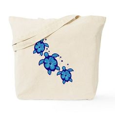 a tote bag with blue flowers painted on the front and bottom, sitting against a white background