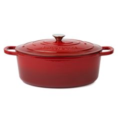 a red casserole dish with a lid on the top and bottom, in front of a white background