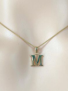 This letter initial pendant is so adorable, minimal and made of solid gold.  This dainty initial necklace elegant enough to wear alone or layered with other necklaces. Perfect gift for Valentine's Day!!  Details:  Gold: 10K Solid Gold Color: Yellow Gold or White Gold Size: 8x9mm approximately  Weight approximately : 0.4g 10K  Stamped: 417 or 10K  Chain: Cable Chain 0.9mm Length: 16-22 inches  Condition: New All Letters are available!!  Please understand that the photos are ENLARGED to show detail for your benefit- please use the measurements provided in the item details/description to understand the size of the gem or Jewelry in the listing- measurements are given in millimeters unless otherwise noted. Please check the photos & sizes in the description carefully before placing an order to M Necklace Initial, Initial M Necklace, M Letter Necklace, M Initial Pendant, M Letter Pendant Gold, 14k Gold Initial Pendant Necklace - Gift For Her, Alphabet Pendant Gold Letters, M Necklace, Dainty Initial Necklace