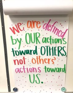 a sign that says we are defined by our actions toward others not others actions toward us