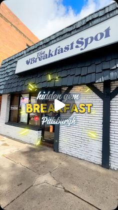 the front of a restaurant with an advertise for breakfast on it's side